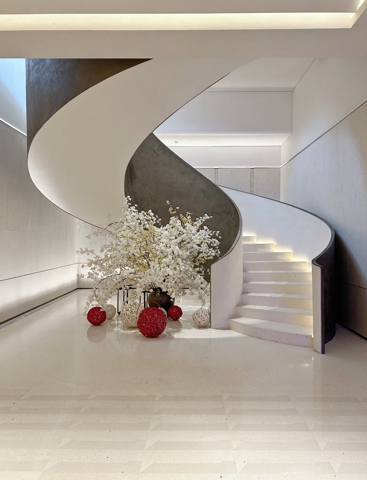 Luxury curved staircase with integrated architectural lighting