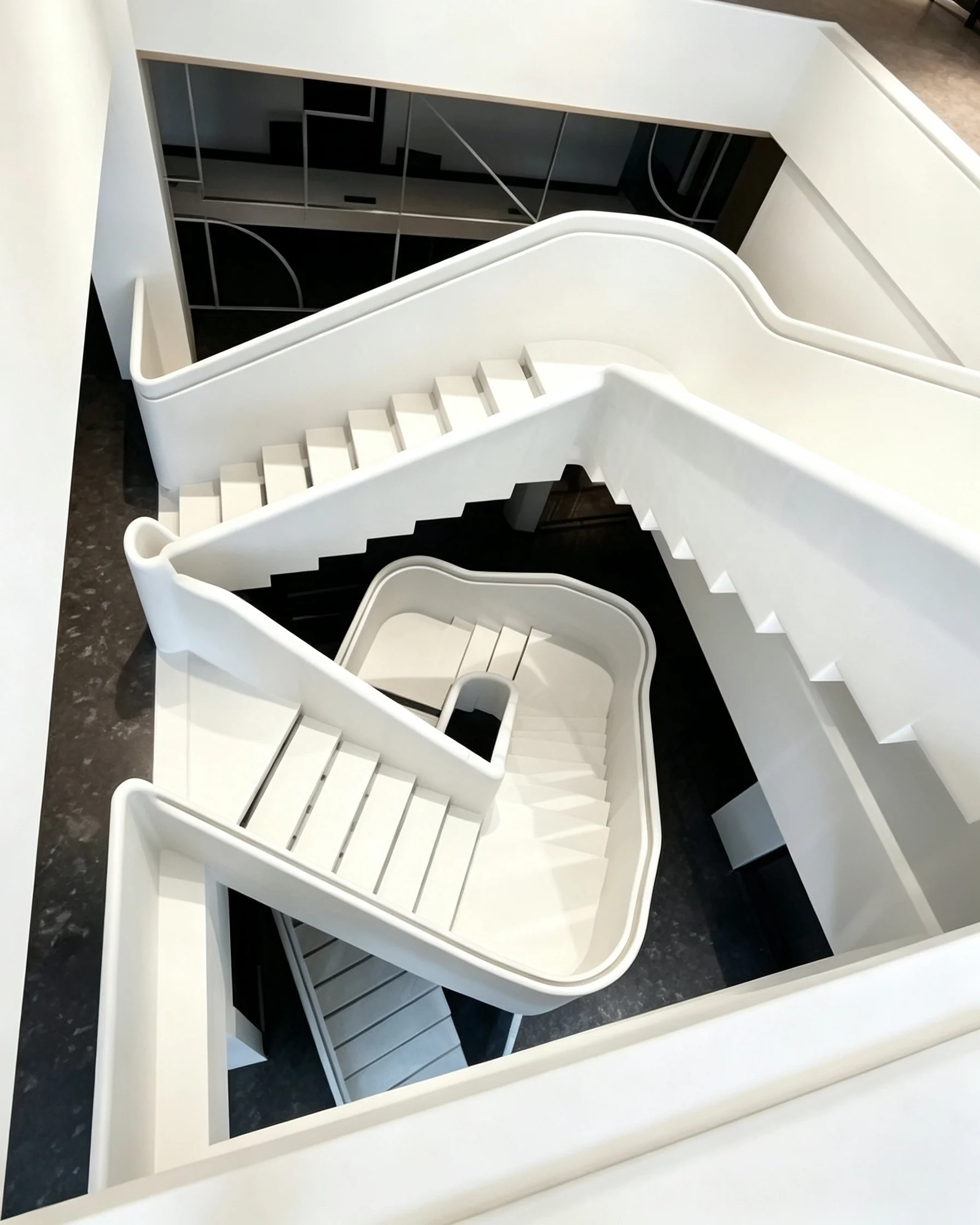 Custom spiral steel staircase designed for a luxury residence