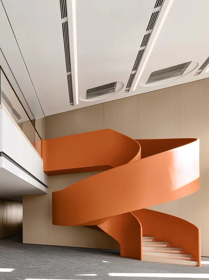 Orange sculptural curved steel staircase in a modern luxury interior