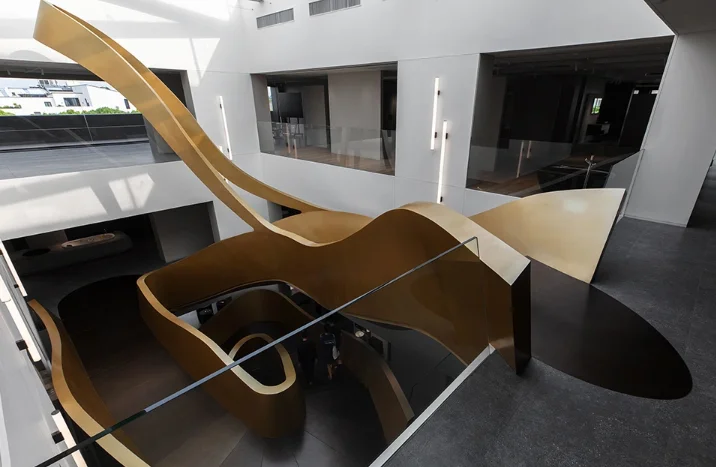 Curved steel staircase for a luxury villa interior