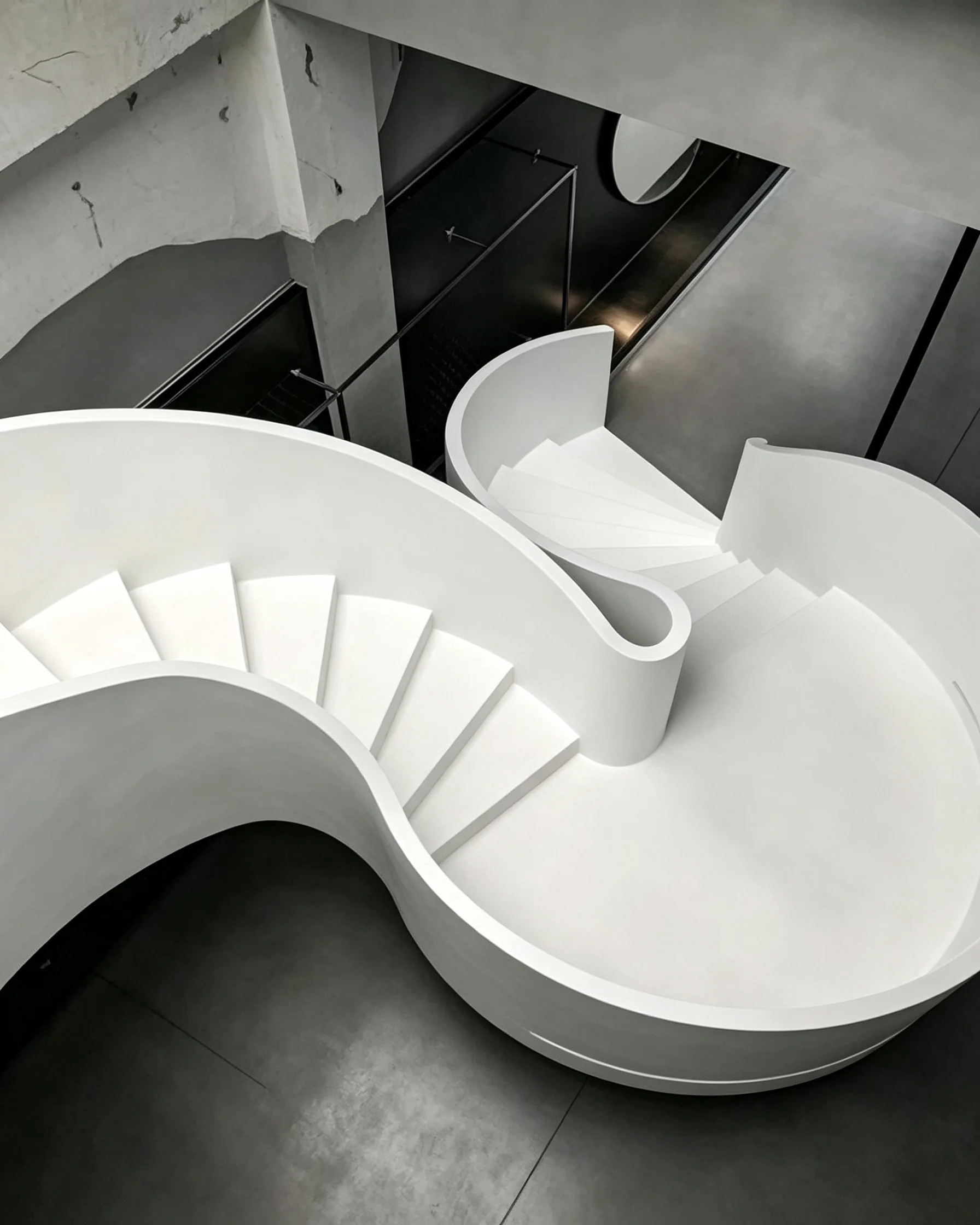 Custom curved steel staircase in a luxury residence