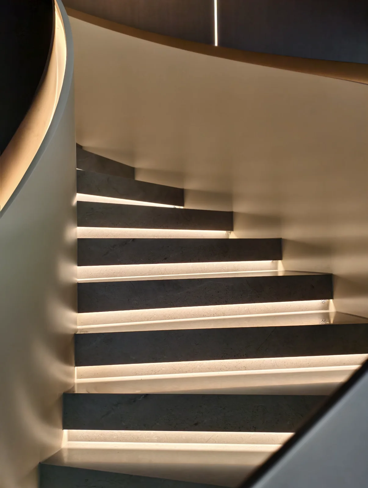 Luxury stone stair treads with integrated LED architectural lighting