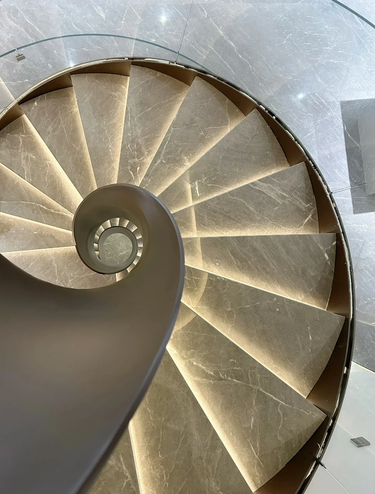 Custom spiral steel staircase in a luxury residential interior